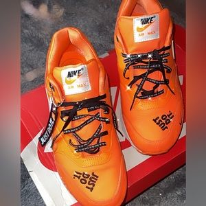 Men’s Nike shoes, size 10 color, orange, black writing black laces